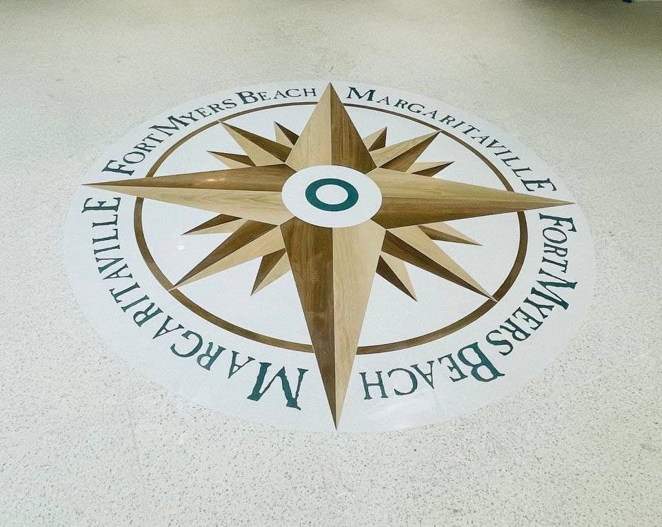 Compass medallion inlaid into the floor of a resort lobby